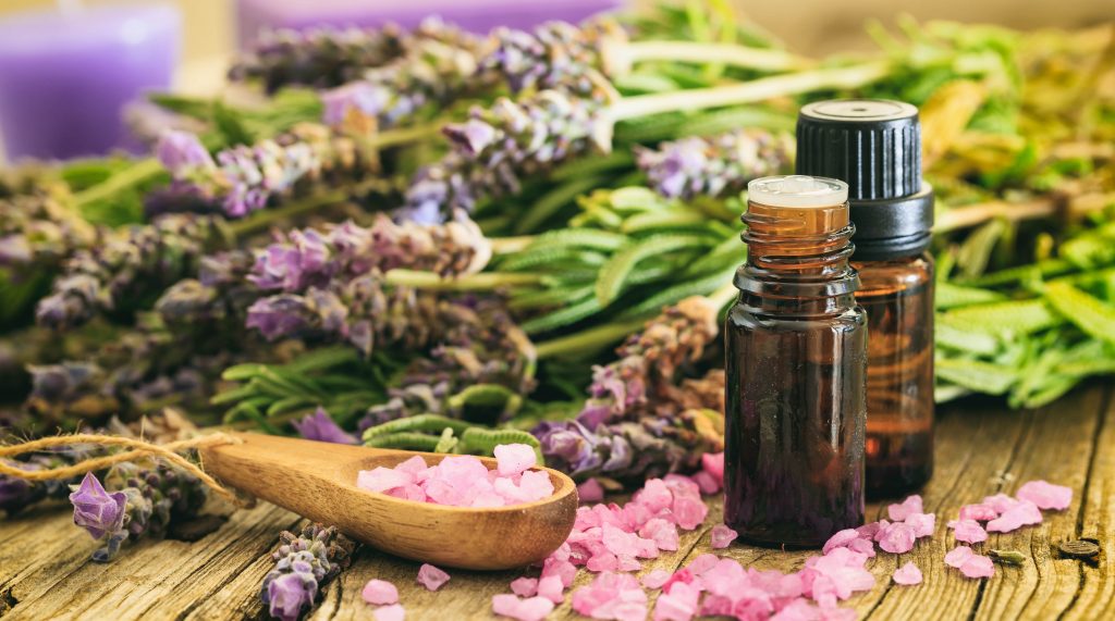 Lavender essential oil for massage spread on table